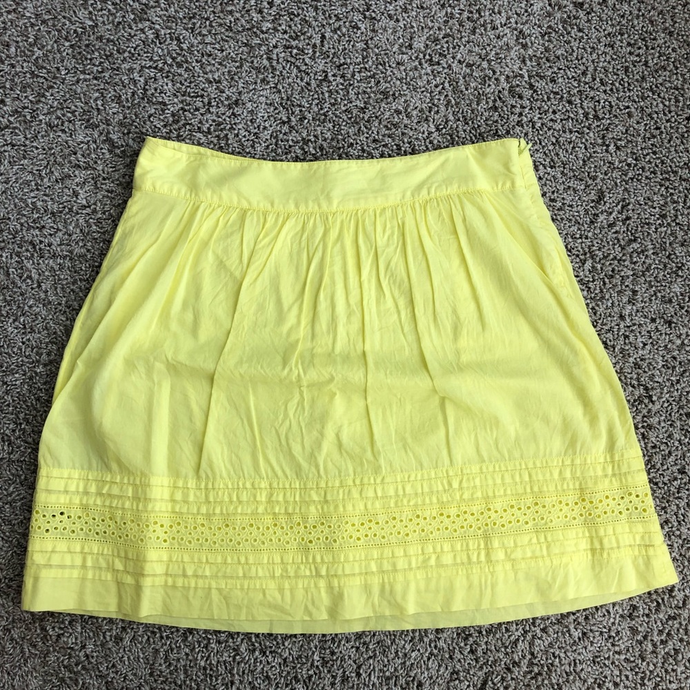 Above the knee yellow eyelet skirt